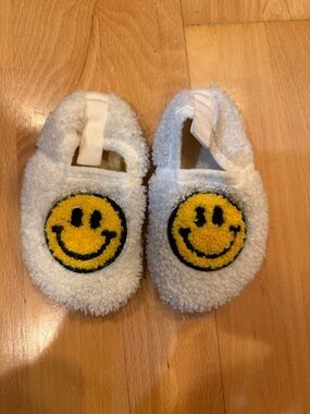 White Fuzzy Baby Slippers with Yellow Smiley Face